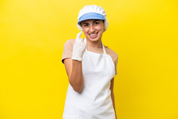 Fishwife woman over isolated background doing coming gesture
