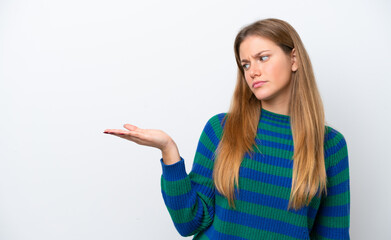 Young caucasian woman isolated on white background holding copyspace with doubts