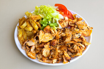 Turkish and Arabic Traditional Ramadan doner kebab with tasty tomato sauce and rice or turkish...