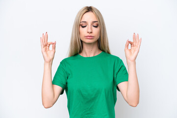 Pretty blonde woman isolated on white background in zen pose