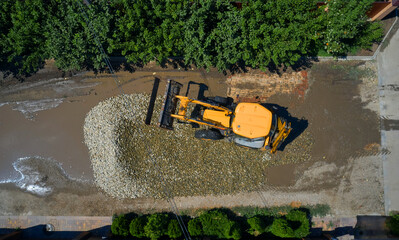 top view of the excavator leveling the road