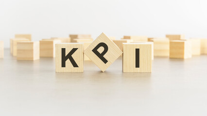 word KPI is made of wooden blocks on white background