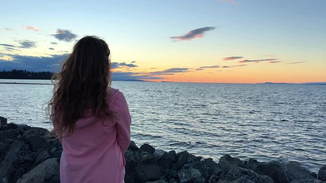 sunset on Ocean Horizon mountains are far visible many clouds and bright colors slow motion video suitable for music relaxation background For text silence peace Parksville beach Surfside RV resort
