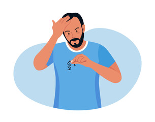 Alopecia and hair problems, baldness. Young man looks sadly at strands of hair in hand. Character feel upset because of hair loss. Lack of vitamins and important amino acids. Person in stress