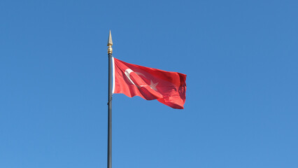 Naklejka na ściany i meble Turkish flag waving in the air a sunny day. Symbol of Turkey. Turkey national background.