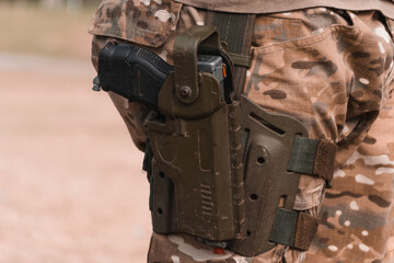 Airsoft pistol in holster