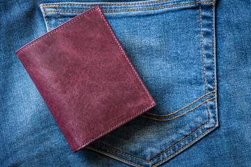 Burgundy genuine leather men zipper wallet with jeans, leather industry concept