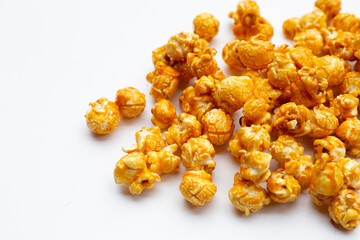 Honey caramel popcorn on white background.