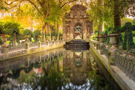 Peaceful Medici fountain pond in Luxembourg gardens, Paris, France