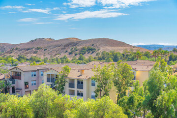 Fototapeta na wymiar Residential complex buildings near the mountain at Ladera Ranch in South California