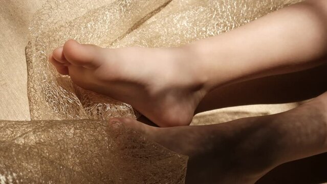 Close up bare foot in the morning at home, relaxing. Comfort aesthetics style. Shadow and sunlight