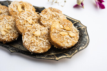 Amrit peda or Amrut pedha or pera is an Indian sweet made from milk and sugar with coconut topping