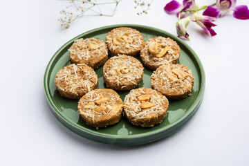Amrit peda or Amrut pedha or pera is an Indian sweet made from milk and sugar with coconut topping