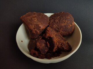 close-up of palm sugar on black background