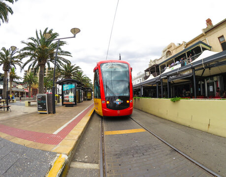 ADELAIDE, SOUTH AUSTRALIA. - On December 18, 2015 - Light Rail Train Stopping At Glenelg Beach Station In The Cloudy Day.