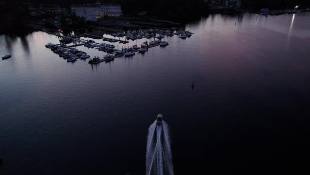 Aerial drone footage boats in harbour at sunset, Sooke BC, sail boats, marina, sunset sky. 4K 24FPS.