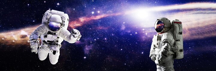 Picture of astronaut spacewalking with glowing stars . Astronaut in outer space. Elements of this...