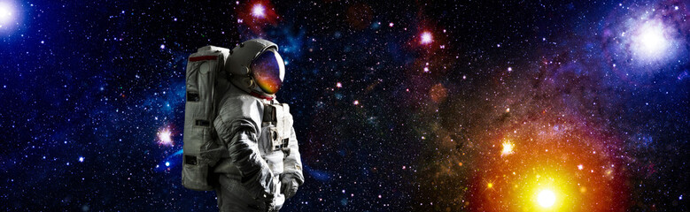 Picture of astronaut spacewalking with glowing stars . Astronaut in outer space. Elements of this...