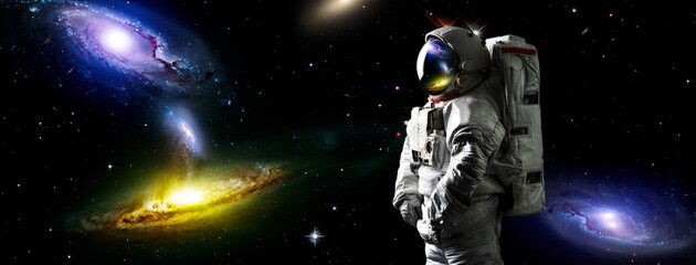 Picture of astronaut spacewalking with glowing stars . Astronaut in outer space. Elements of this...