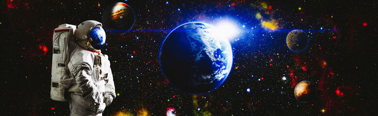 Picture of astronaut spacewalking with glowing stars . Astronaut in outer space. Elements of this...
