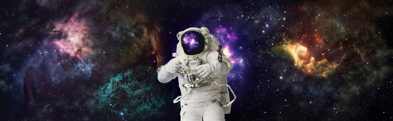 Astronaut in space in the solar system Earth. Blue light on background. Elements of this image...