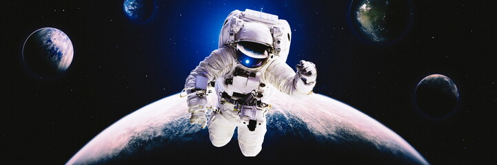 Picture of astronaut spacewalking with glowing stars . Astronaut in outer space. Elements of this...