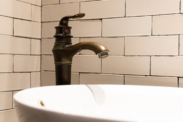 brass faucet in the bathroom