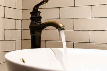 brass faucet in the bathroom