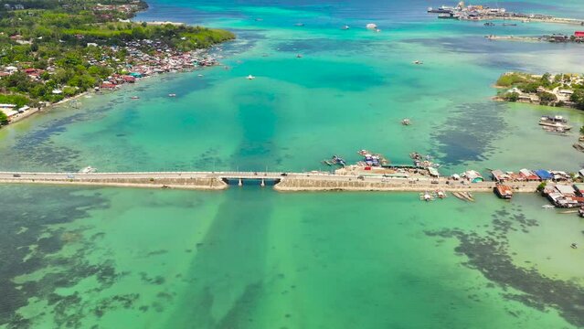 Aerial view of the Dauis bridge between Bohol and Panglao Islands. Bridge over the sea Strait with traffic and cars. Bohol,Philippines.