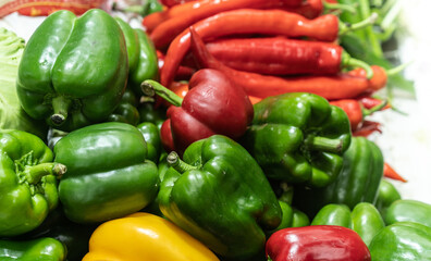 Fototapeta na wymiar plenty of red and green peppers