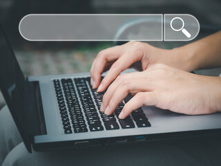 Search a young woman using a laptop to search for information using Search Console, a large...