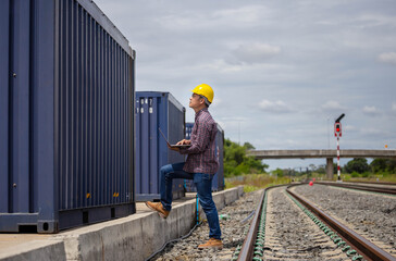 Foreman in hardhat control loading containers box from cargo, Engineer with laptop, Industrial worker in industry containers cargo