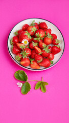 Strawberries on color background.