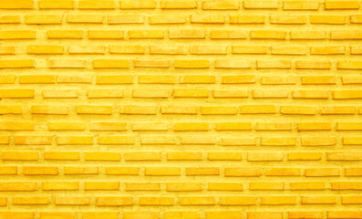 Brick wall yellow paint texture background. Brickwork and stonework flooring interior.
