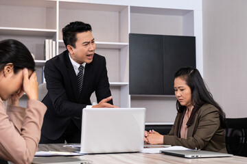 Asian men manager scold and angry with their employee inside of office meeting room with upset and stress worker. Business failure. Problem in working office, Negative emotion workplace.