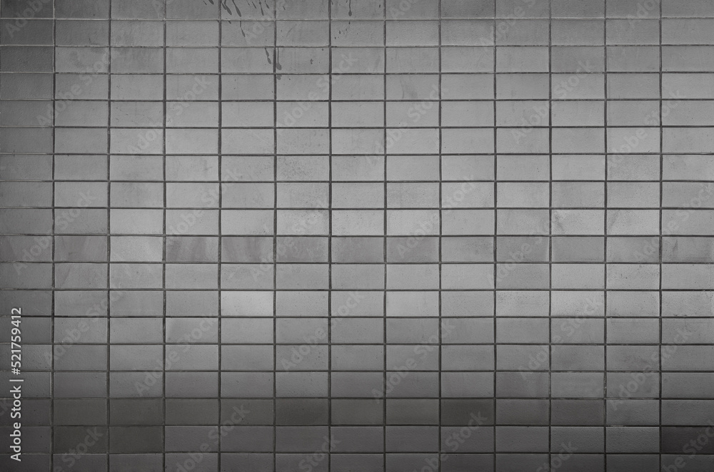 Poster wall made of tiles or blocks with some stains, front view. high resolution full frame textured backg