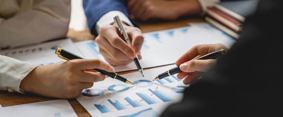 Teamwork with business people consultant describes a marketing plan to set business strategies....
