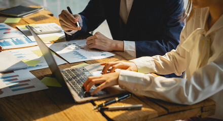 Teamwork with business people consultant describes a marketing plan to set business strategies....