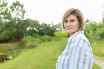 portrait of a woman smiling in the garden