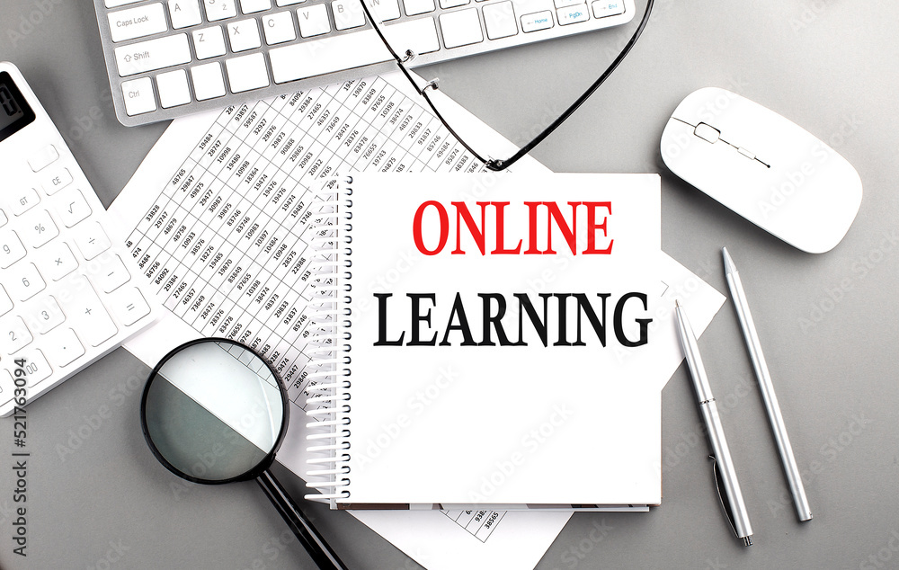 Poster online learning text on notepad on chart with keyboard and calculator on grey background