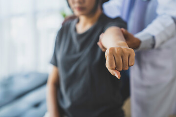 The doctor counsels the patient about pain in the muscles of the arms and elbows. office syndrome problem physical therapy diagnostic concept