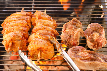 South African braai. Chicken kebabs and lamb chops meat on the grill