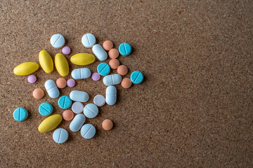 Pharmaceutical medicine pills in both tablets and capsules with the vintage retro picture style. Pharmacy theme and treatment medication as concept.