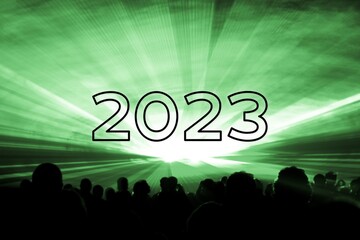 Happy new year 2023 green laser show party people crowd. Luxury entertainment with audience silhouettes turn of the year celebration. Premium nightlife event at holidays season party time
