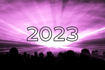 Happy new year 2023 pink laser show party people crowd. Luxury entertainment with audience silhouettes turn of the year celebration. Premium nightlife event at holidays season party time
