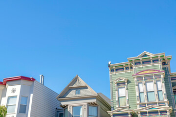 Low angle view of houses with different designs against the clear sky in San Francisco, California