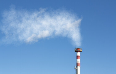 Smoke comes out of the chimney. concept of pollution and climate change.
