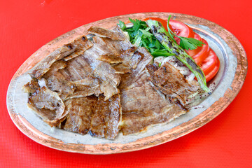 Turkish and Arabic Traditional Ramadan doner kebab with tasty tomato sauce and rice or turkish...