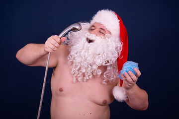 Funny fat Santa Claus is washing himself in the shower.