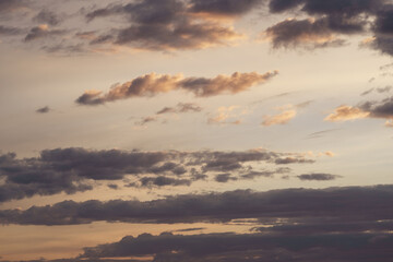 Soft clouds with warm light during summer sunset